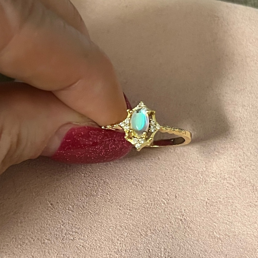 Gold and White Moonstone Ring with Ornate Design